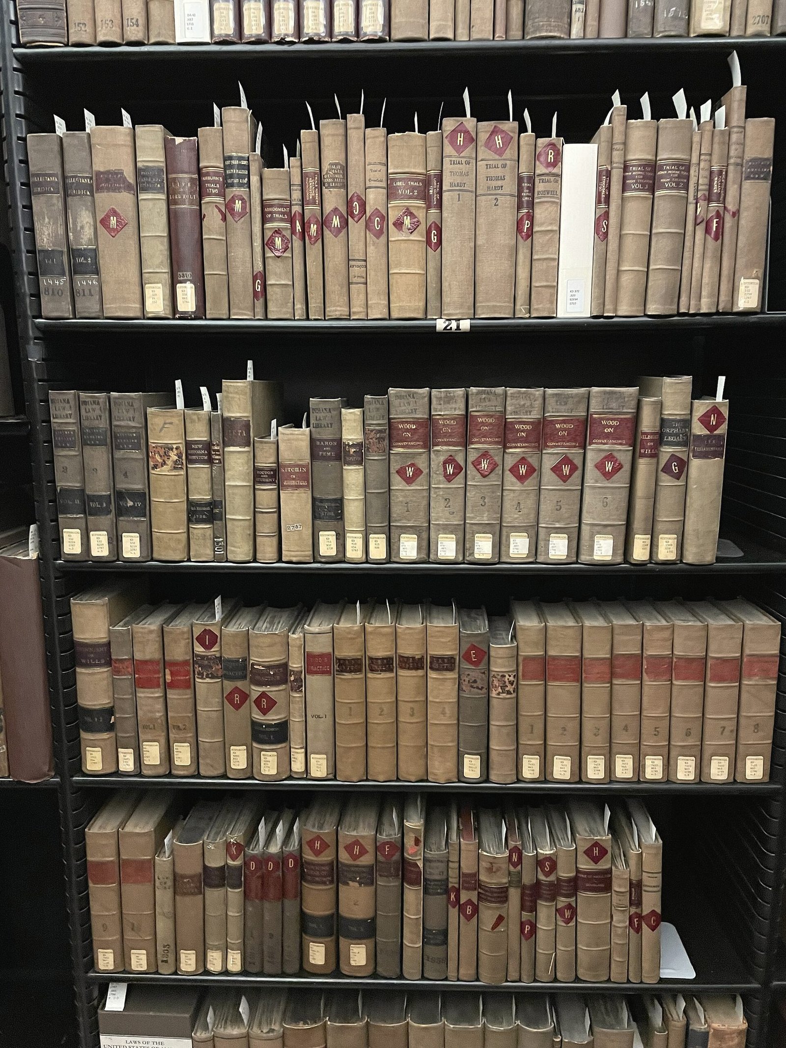 Shelves of old leather-bound law reporters in a law library