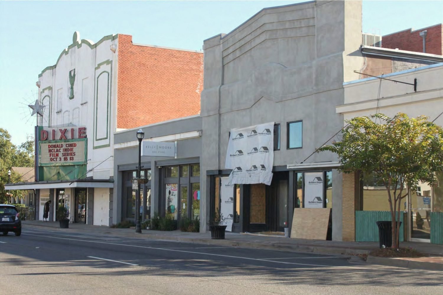 The Dixie Theatre marquee among storefronts on a Ruston street